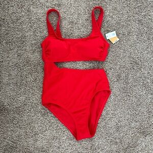 Red one piece swimsuit with open middle